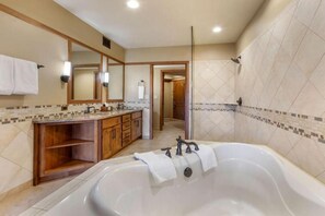 A modern bathroom with a large bathtub, wooden vanity, and tiled walls. - NEW PRICE! - Sedona Summit Resort - 2 Bedroom Sleeps 8, Location and Amenities ! (Sedona)
