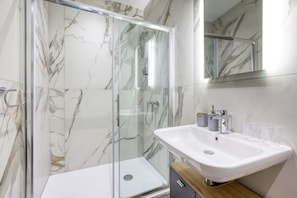 Shower, free toiletries, hair dryer, towels