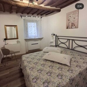 1 dormitori, planxa i posts de planxar, Internet i roba de llit 