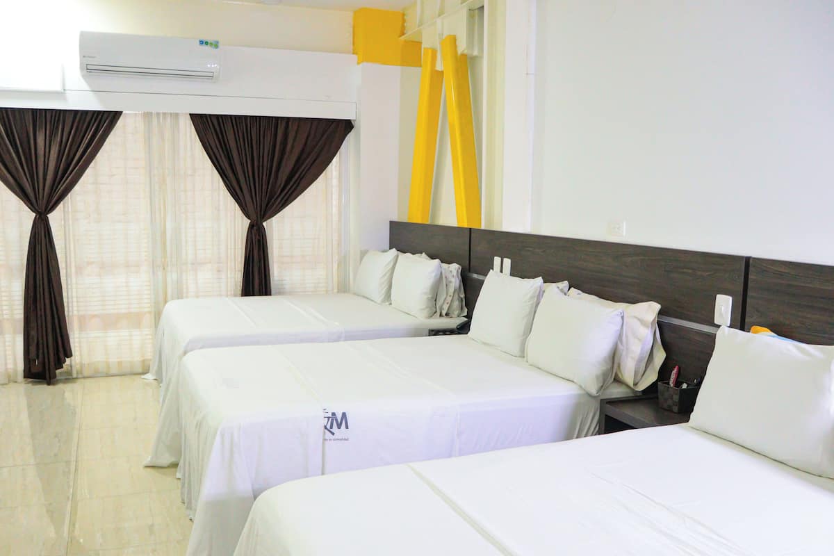 Junior Quadruple Room, Multiple Beds | In-room safe, iron/ironing board, free WiFi