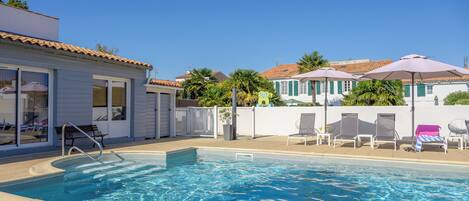 Seasonal outdoor pool, pool umbrellas, pool loungers