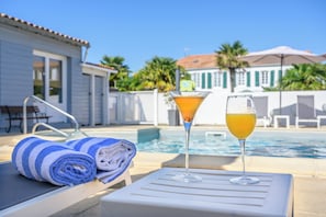 Seasonal outdoor pool, pool umbrellas, pool loungers