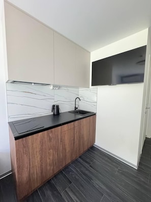 Mini-fridge, microwave, stovetop, cookware/dishes/utensils