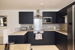 Departamento, balcón | Cocina privada | Tetera eléctrica