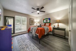 1 bedroom, desk, iron/ironing board, travel crib