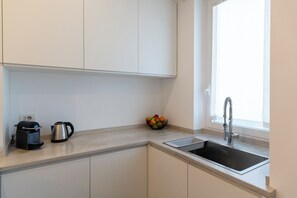 Comfort Apartment | Private kitchen | Full-size fridge, oven, stovetop, dishwasher