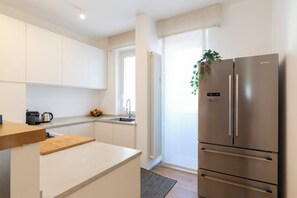 Comfort Apartment | Private kitchen | Full-size fridge, oven, stovetop, dishwasher