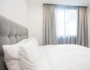 2 dormitorios, tabla de planchar con plancha, Internet y ropa de cama