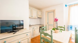 Apartment, 1 Bedroom | Dining room - Charming Baia Marina Apartments With Stunning View 1 Bedroom Apartment Sleeps 4 (Orosei)