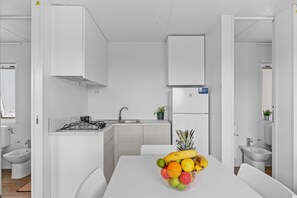 Fridge, stovetop, dishwasher, coffee/tea maker