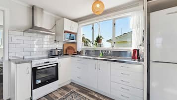Fridge, microwave, toaster, cookware/dishes/utensils
