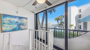 Interior - Three-bedroom, two-bath condo at Anglers Cove. Partial view of water and pool. (Marco Island)