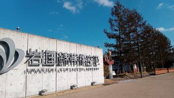 A concrete wall with large, bold lettering and a website URL.