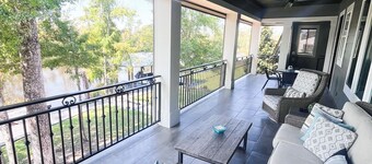 River front paradise with large dock and outdoor space, great for entertaining.