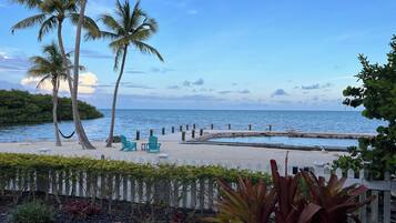 On the beach, sun loungers, beach towels