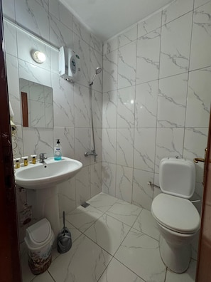 Shower, slippers, towels, soap