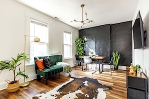 Jungle Beat | Living area | 55-inch Smart TV with digital channels, Netflix, Hulu - Jungle House Historic Lofts – German Village (Columbus)