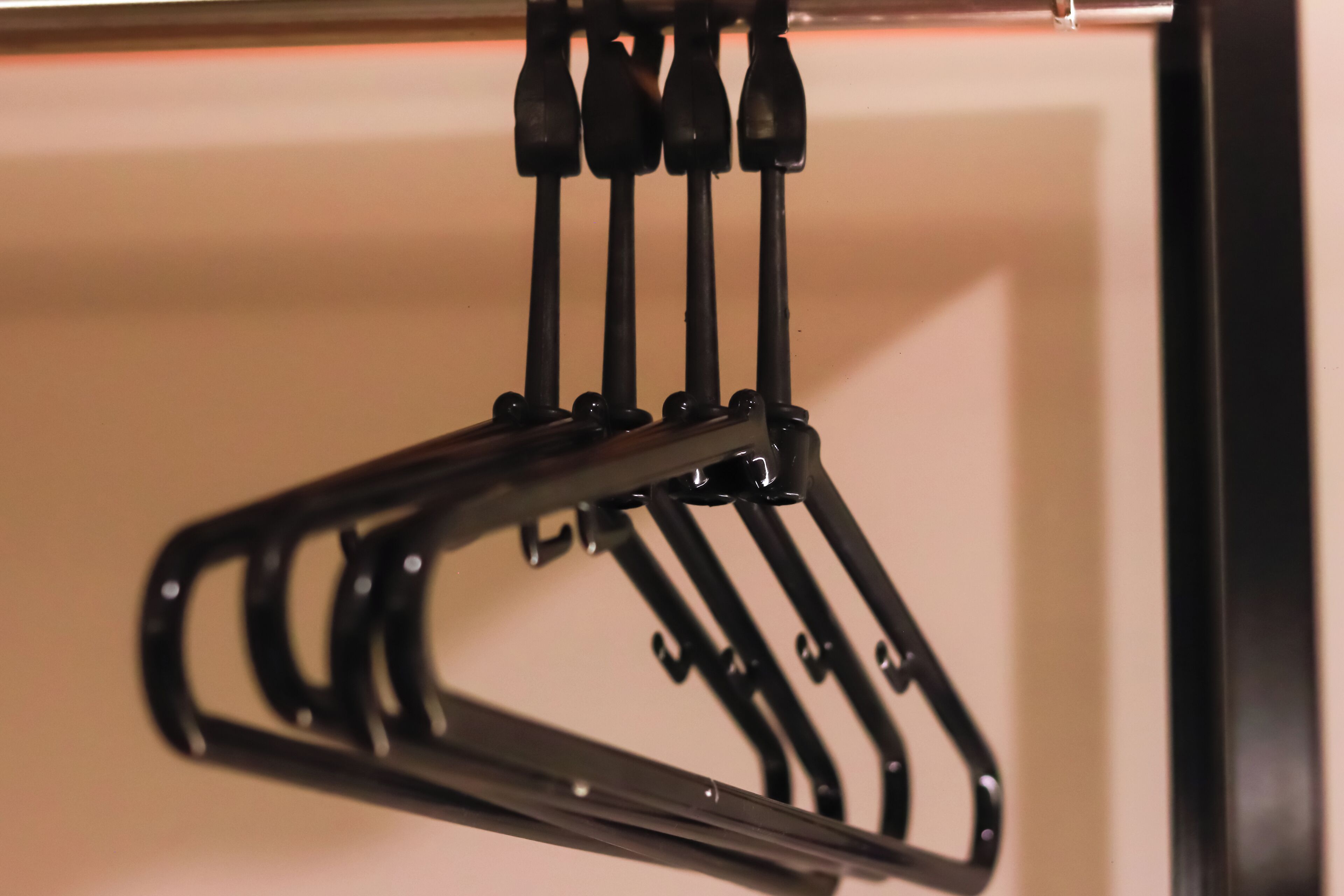 A black metal rack with multiple hooks, likely for hanging items.