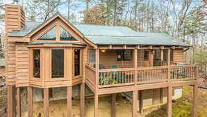 A wooden cabin with a balcony, large windows, and a chimney. - Vista Cabin Getaway – Perfect Views + Dog Friendly (Blue Ridge)
