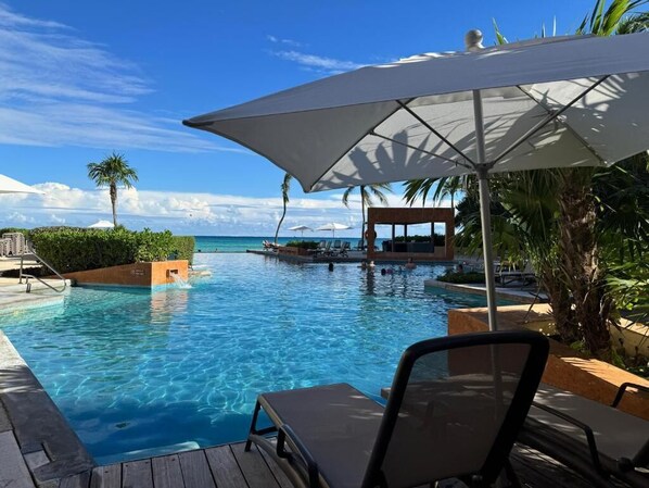 Outdoor pool, pool umbrellas, pool loungers