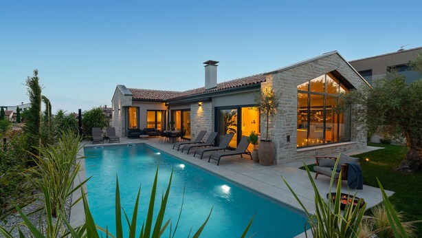 A modern house with a swimming pool, stone exterior, and large windows. - Beautiful home in Tar (Tar)