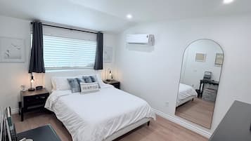 1 bedroom, desk, iron/ironing board, travel crib