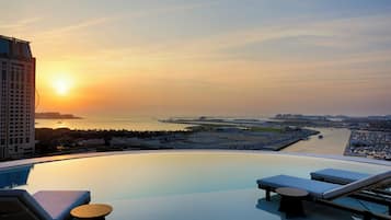 2 outdoor pools, open 7:00 AM to 8:00 PM, pool loungers