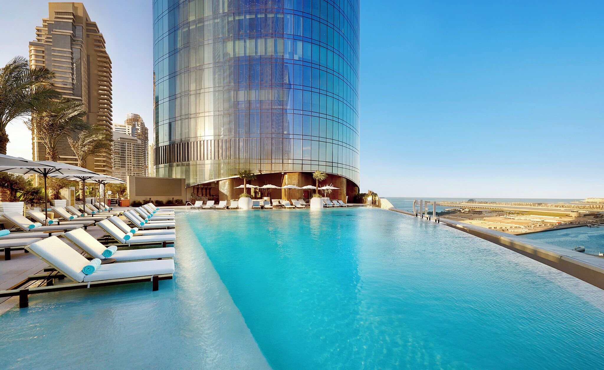 2 outdoor pools, open 7:00 AM to 8:00 PM, pool loungers