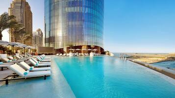 2 outdoor pools, open 7:00 AM to 8:00 PM, pool loungers