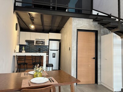 Modern double-height loft new and equipped with its own parking lot