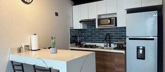 Modern double-height loft new and equipped with its own parking lot