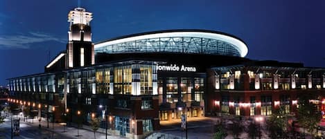 A modern building with a large glass facade and a prominent tower, labeled 'Ionwide Arena.'