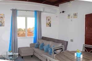 Appartement, vue sur le jardin | Aire de séjour