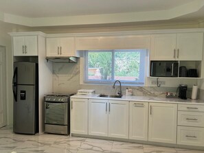 Apartment, Mountain View, Ground Floor | Private kitchen | Fridge, microwave, oven, stovetop - Agape Suites (Soufrière)