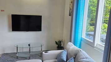 Appartement, chambres communicantes, vue jardin | Coin séjour