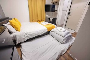 1 غرفة نوم ومكواة/لوح كي وواي فاي وملاءات أسرّة