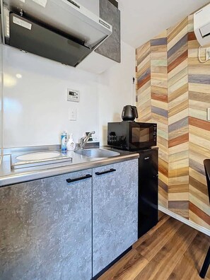 Fridge, microwave, electric kettle, cookware/dishes/utensils