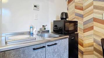 Fridge, microwave, cookware/dishes/utensils