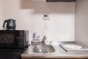 Fridge, microwave, cookware/dishes/utensils