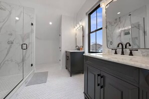 Rainfall showerhead, eco-friendly toiletries, hair dryer, towels