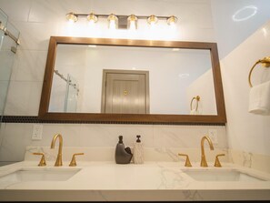 Shower, hair dryer, towels, toilet paper