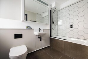 Shower, jetted tub, hair dryer, towels