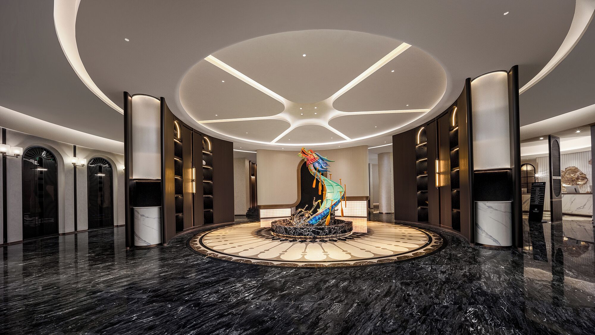 A modern lobby with a central art installation, marble flooring, and contemporary lighting.