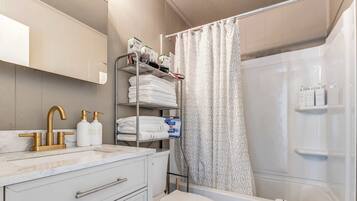 Shower, hair dryer, towels