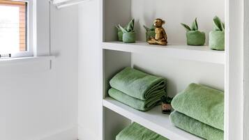 Rainfall showerhead, eco-friendly toiletries, hair dryer, towels