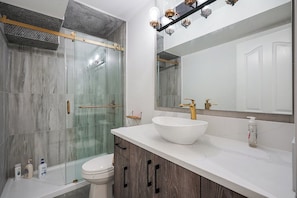 Shower, hair dryer, towels, soap