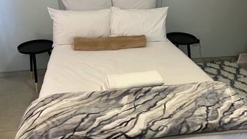 1 غرفة نوم ومكواة/لوح كي وواي فاي وملاءات أسرّة