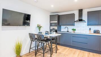 Fridge, microwave, oven, cookware/dishes/utensils