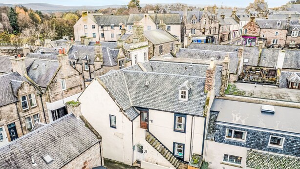 A traditional town with closely packed stone buildings, narrow streets, and a mix of residential and commercial properties. - Fishertown Apartment by Interhome (Nairn)