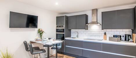 Fridge, microwave, oven, cookware/dishes/utensils